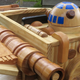 Illustration for article titled This Exquisite Wooden X-wing Rocker Will Make You Miss Being a Kid
